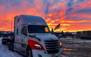 WTL truck with a sunset behind it